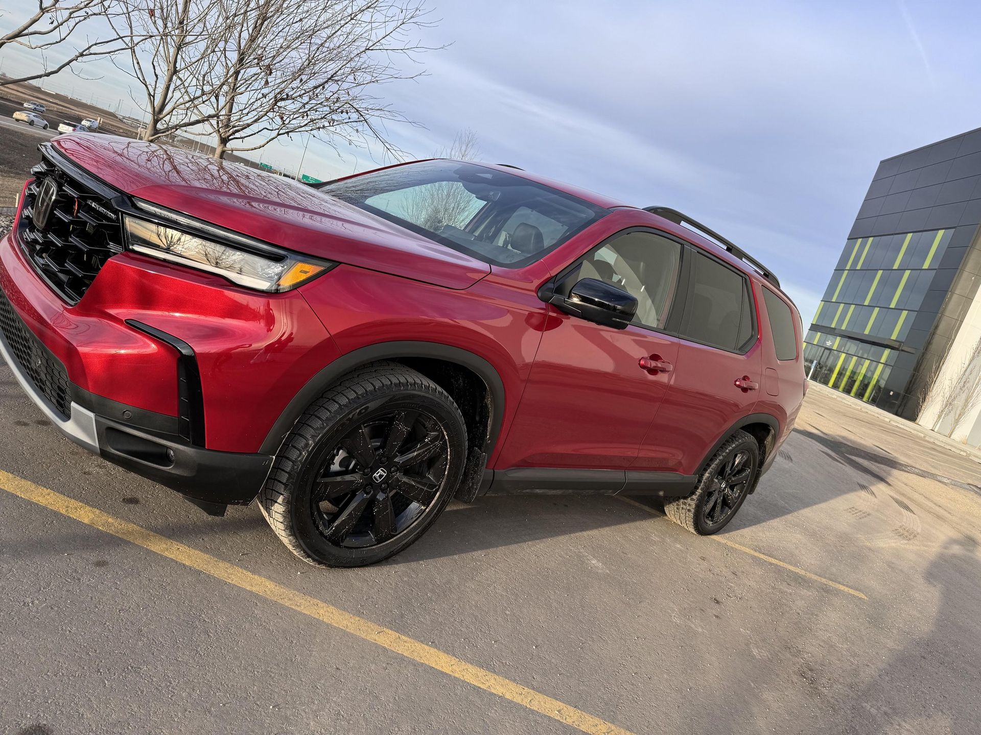 Honda Pilot 2024 in Radiant Red Metallic, front three-quarter view